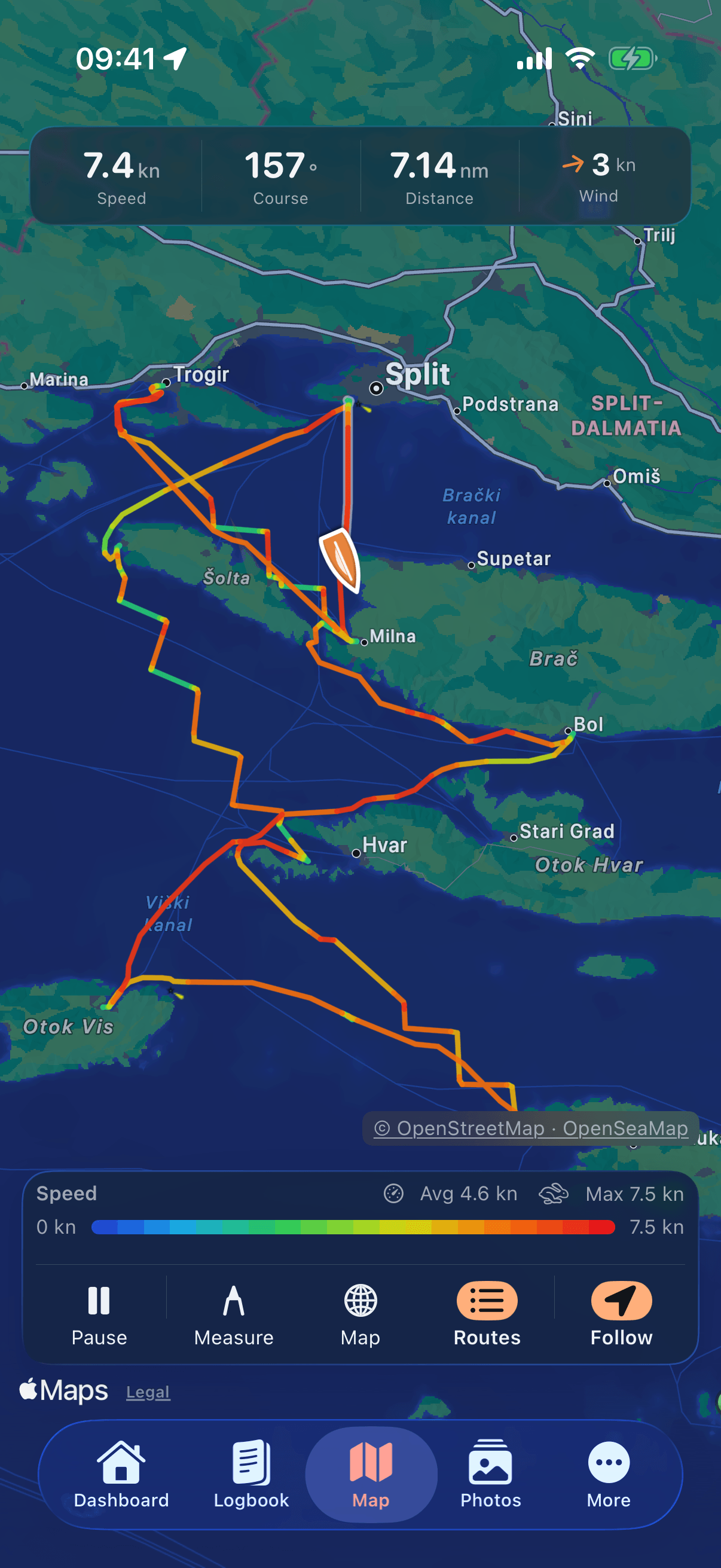 Nautly on an iPhone: the nautical chart under way. Across the top, side by side: 7.4 kn speed, a course of 157 degrees, 7.14 nm distance and 3 kn of wind. Below that lies the recorded track of a round trip in central Dalmatia — from Trogir and Split by way of Šolta, Brač and Hvar to Otok Vis and back — coloured by speed from blue for slow to red for fast; the boat sits as an arrow pointing the way it is heading, off Split. Along the bottom edge of the chart is the credit © OpenStreetMap · OpenSeaMap, and below it the legend with 4.6 kn on average and 7.5 kn as the highest value.